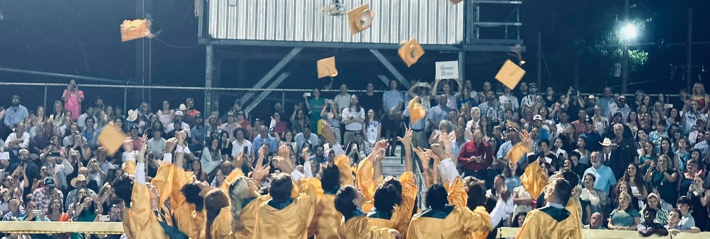 Students celebrating at graduation