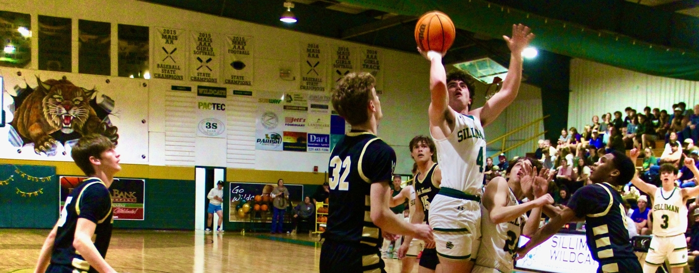 Image of basketball players on the court playing